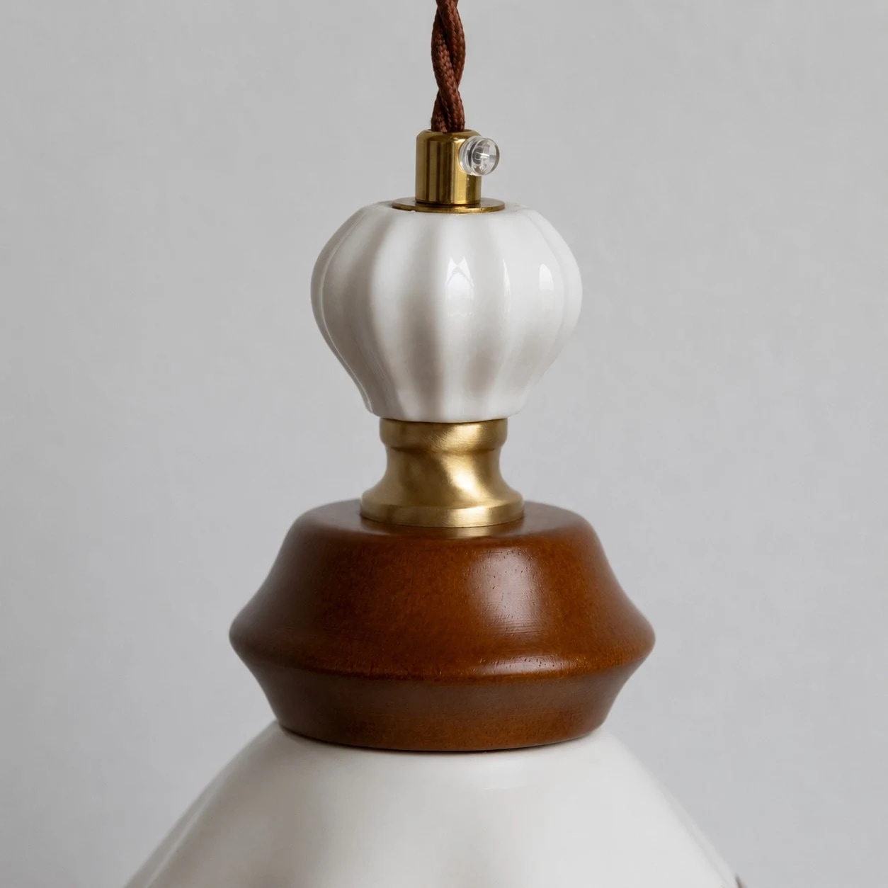 Ceramic socket cap and adjustable hanging cord detail
