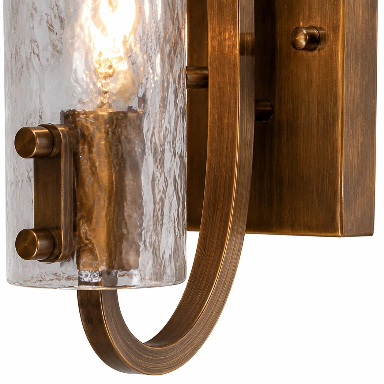 Brass body, rounded support and textured glass shade.