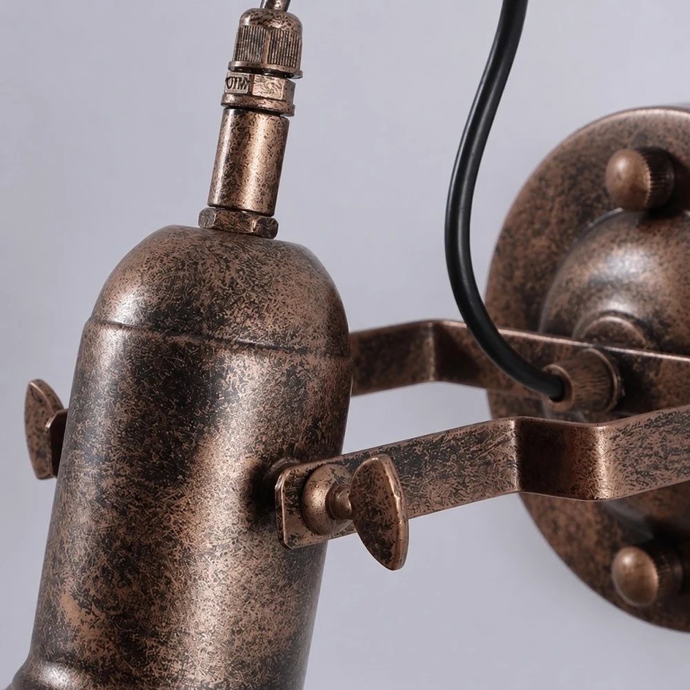 Antique iron wall light arm detail