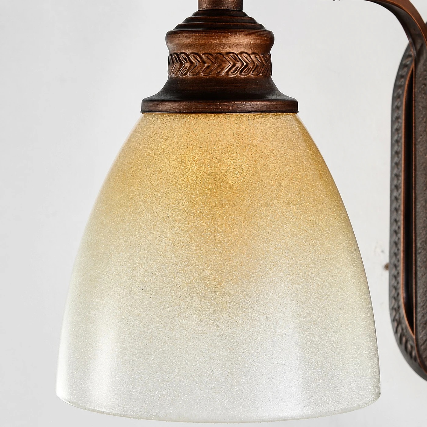 Amber glass shade and antique bronze cap detail