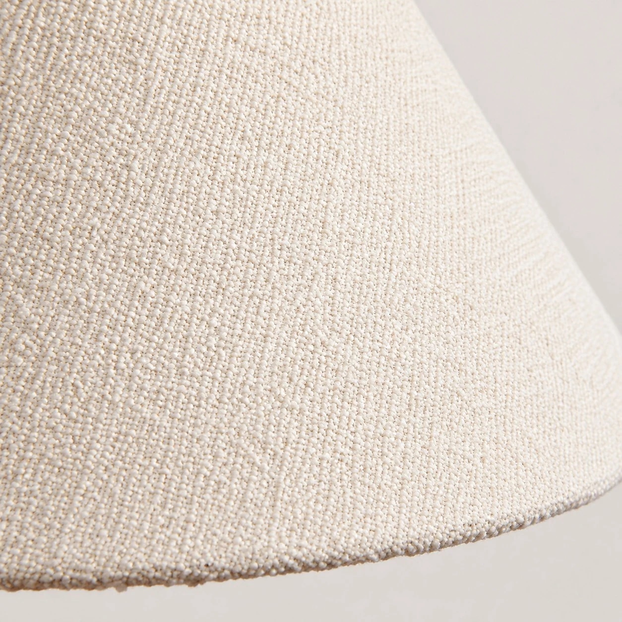 Gros plan sur la texture du tissu tissé crème