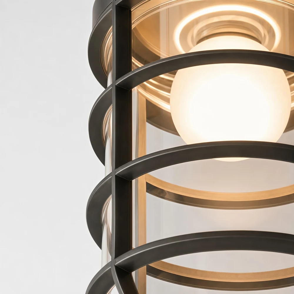 Close view of aged black bronze metal cage and glass shade