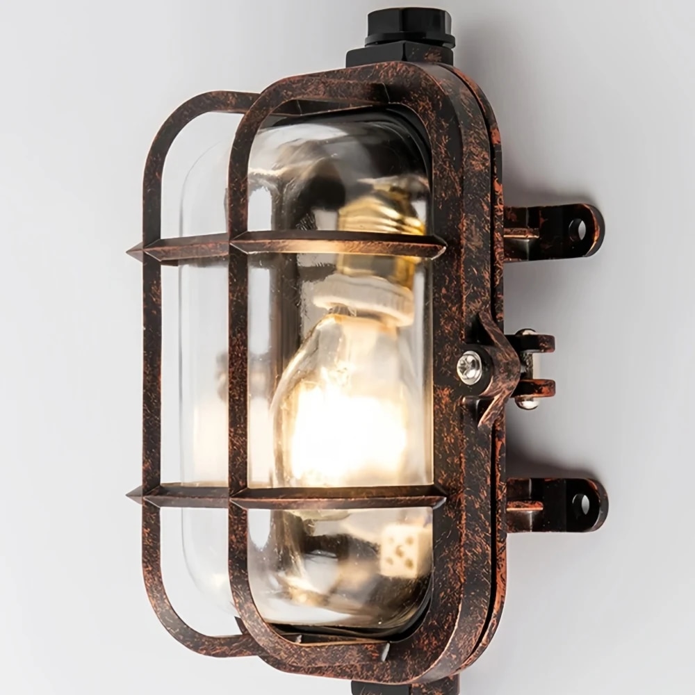 Close-up of cage frame and glass shade