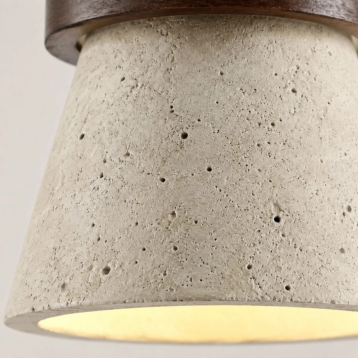 Close view of yellow travertine texture and warm underside glow