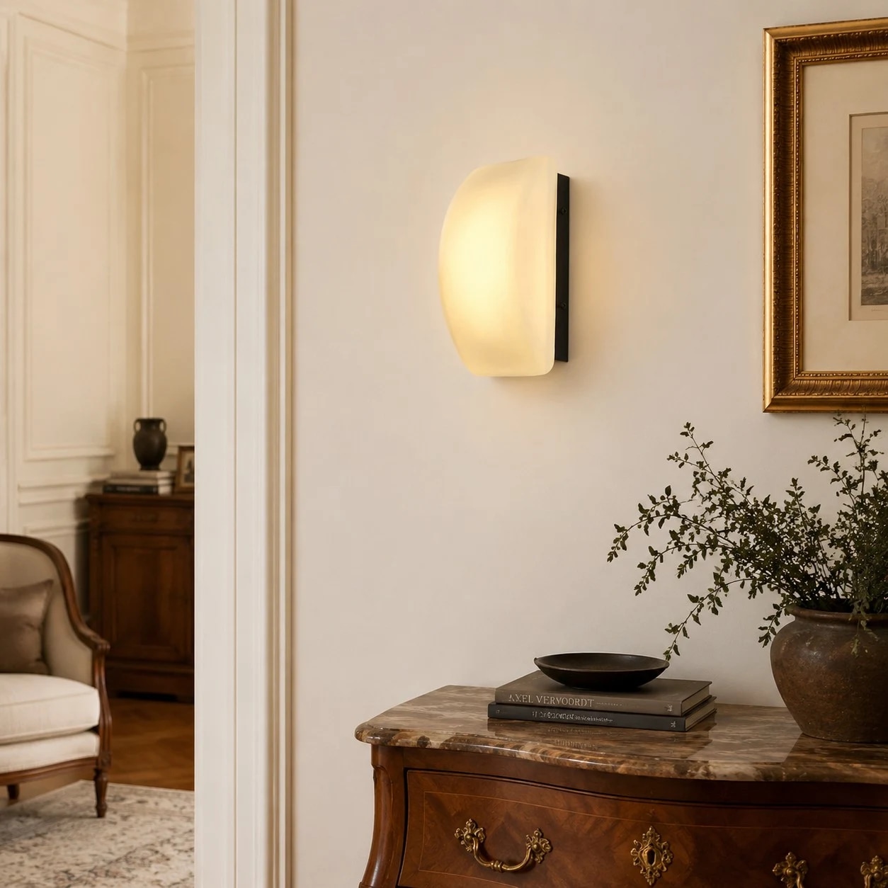 French wall sconce mounted above a console