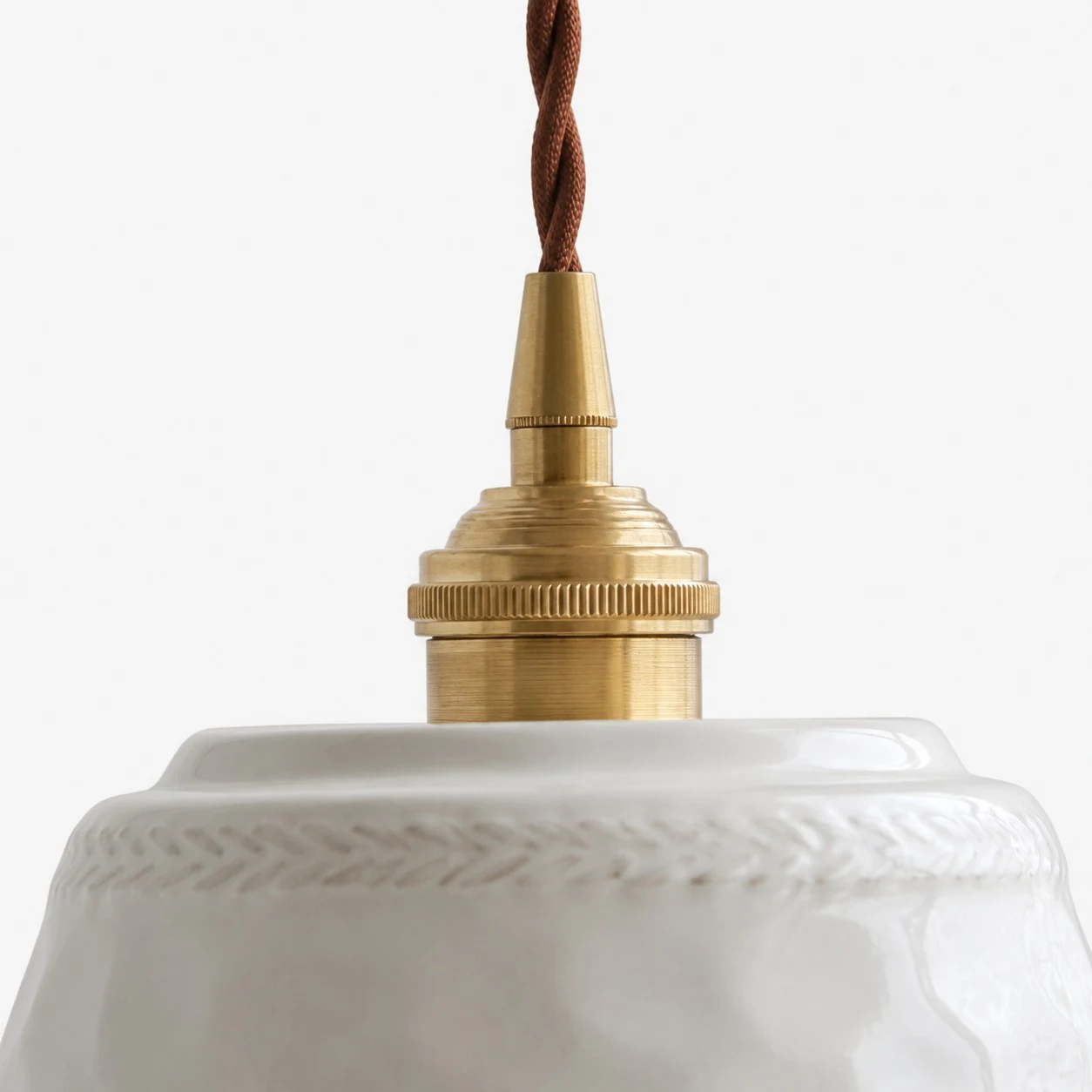 Brass-toned cap and twisted cord