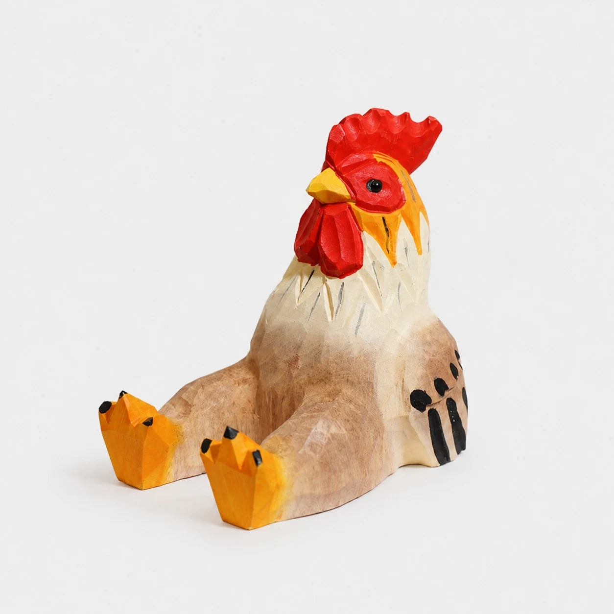 Supporto per telefono in legno intagliato a mano a forma di gallo.