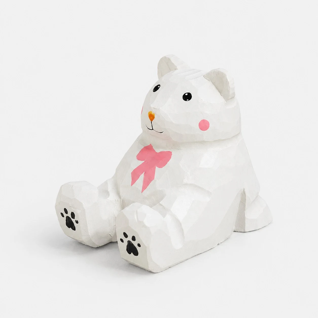 Supporto per telefono in legno intagliato a mano a forma di orso bianco.