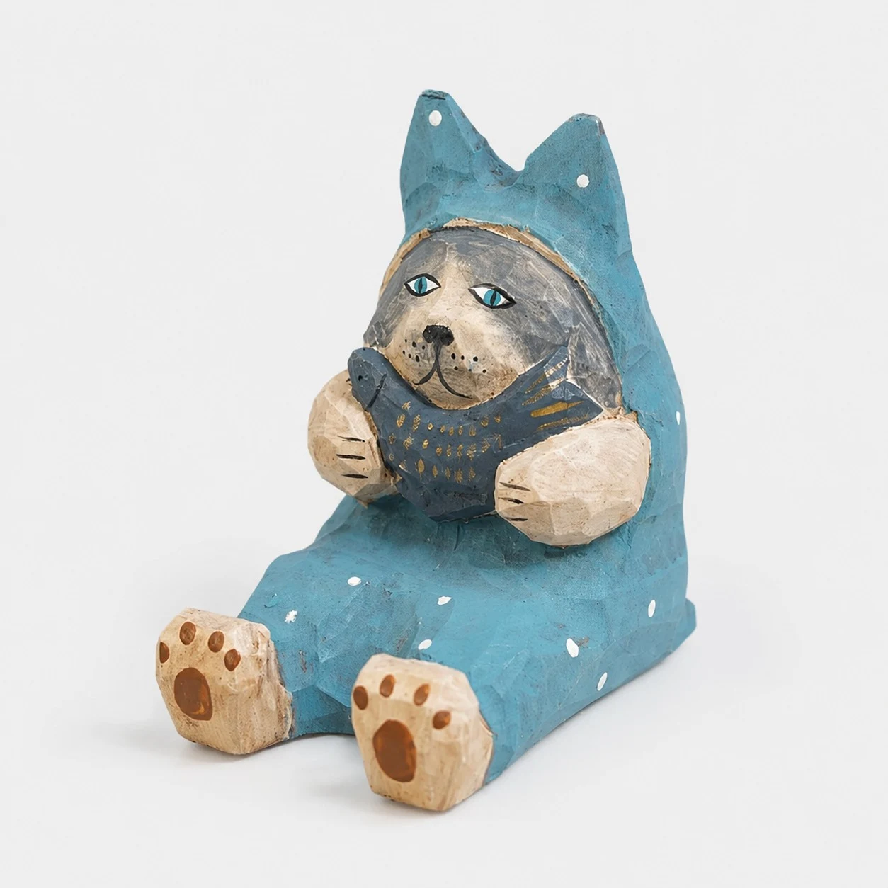 Supporto per telefono in legno intagliato a mano a forma di pesce gatto.