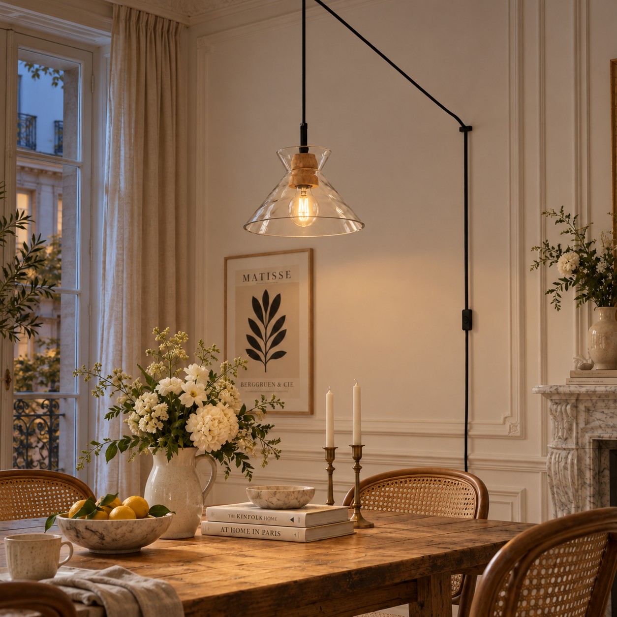Style B pendant switched on above a dining table in the evening