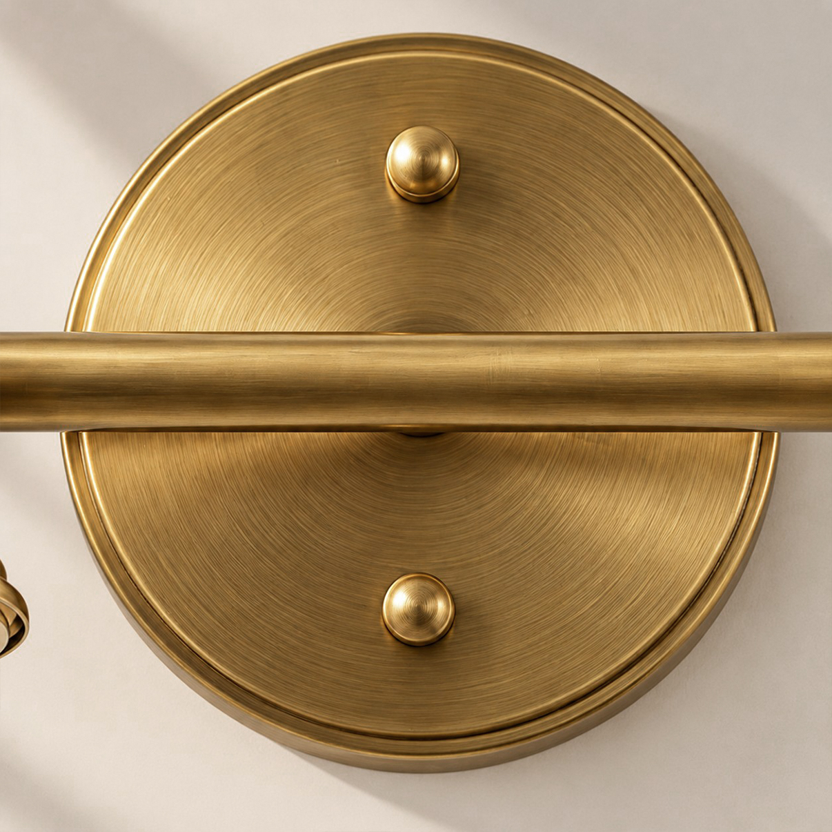 Close-up of Aurelia's brushed brass circular backplate
