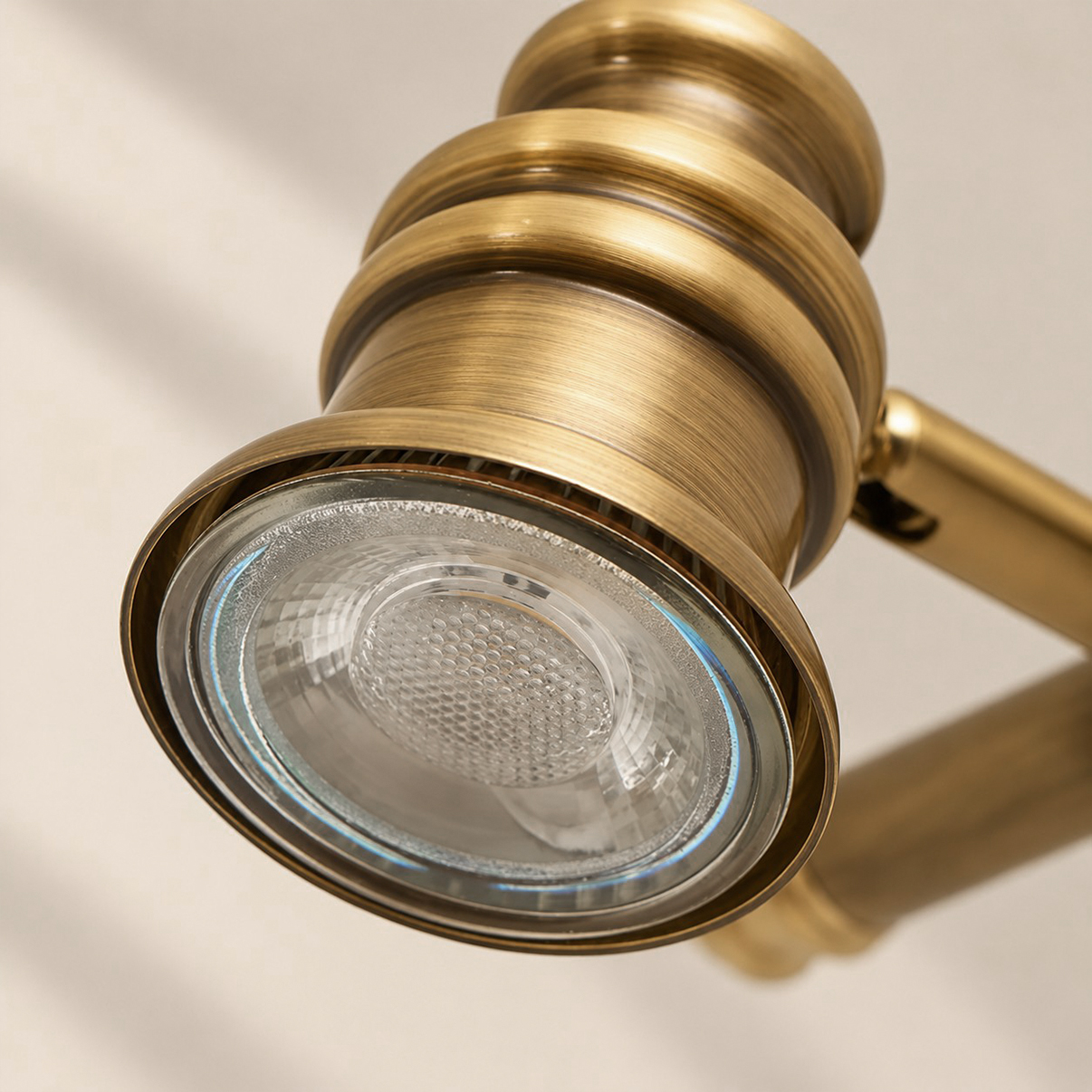 Close-up of Aurelia's illuminated lens and sculpted brass light head