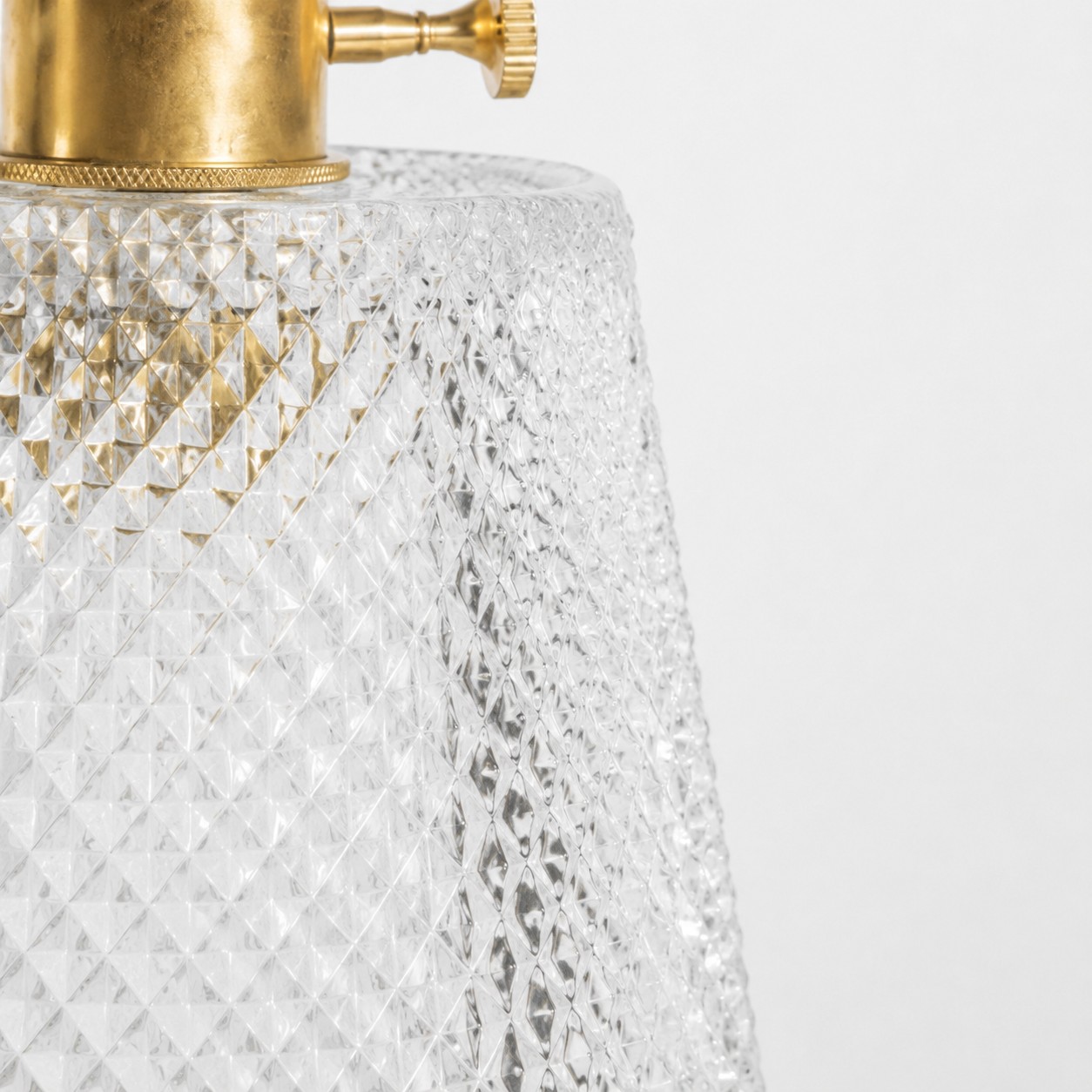 pressed glass edge and sealed brass rim