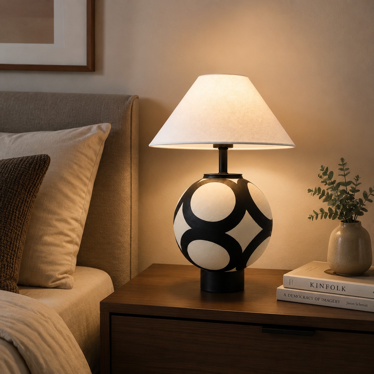 Ceramic globe table lamp beside a bed