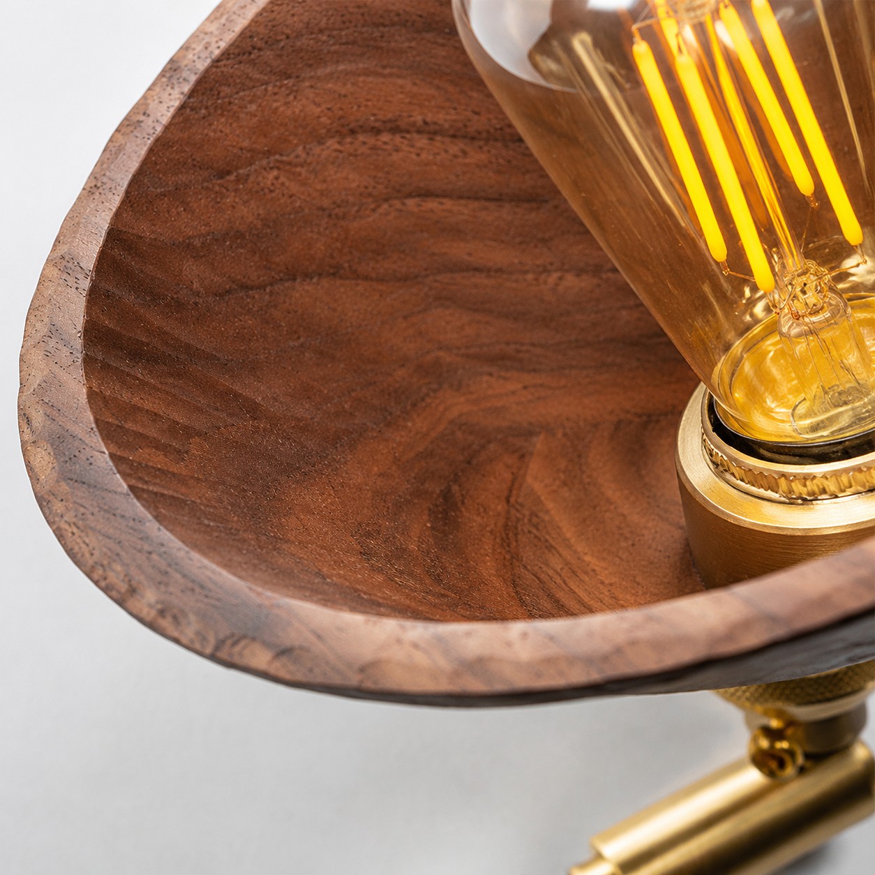 Close view inside the curved solid wood shade