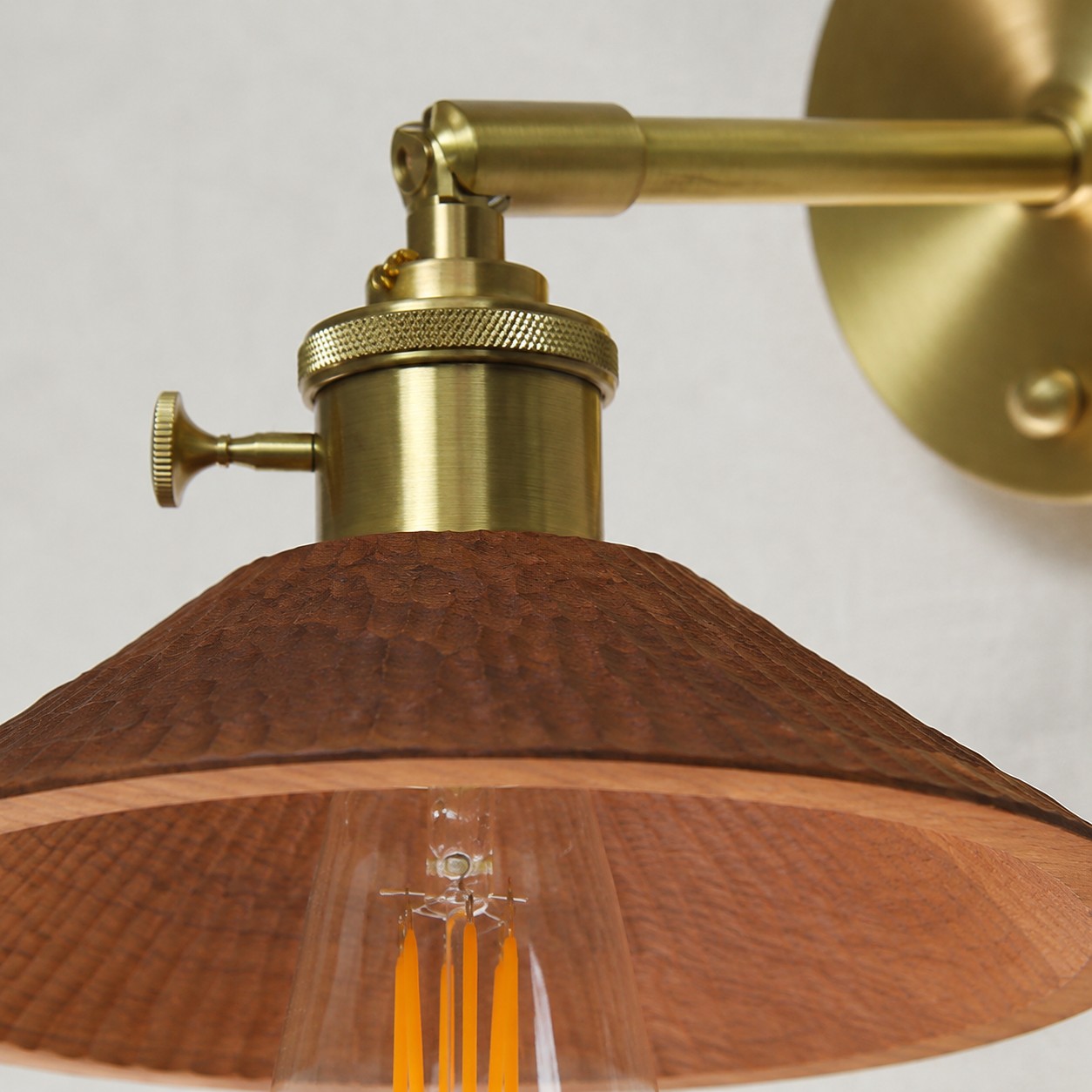 Brass socket and carved wood shade construction