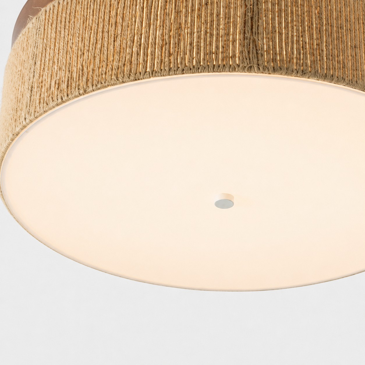 Close-up of the softly diffused LED framed by handwoven rope