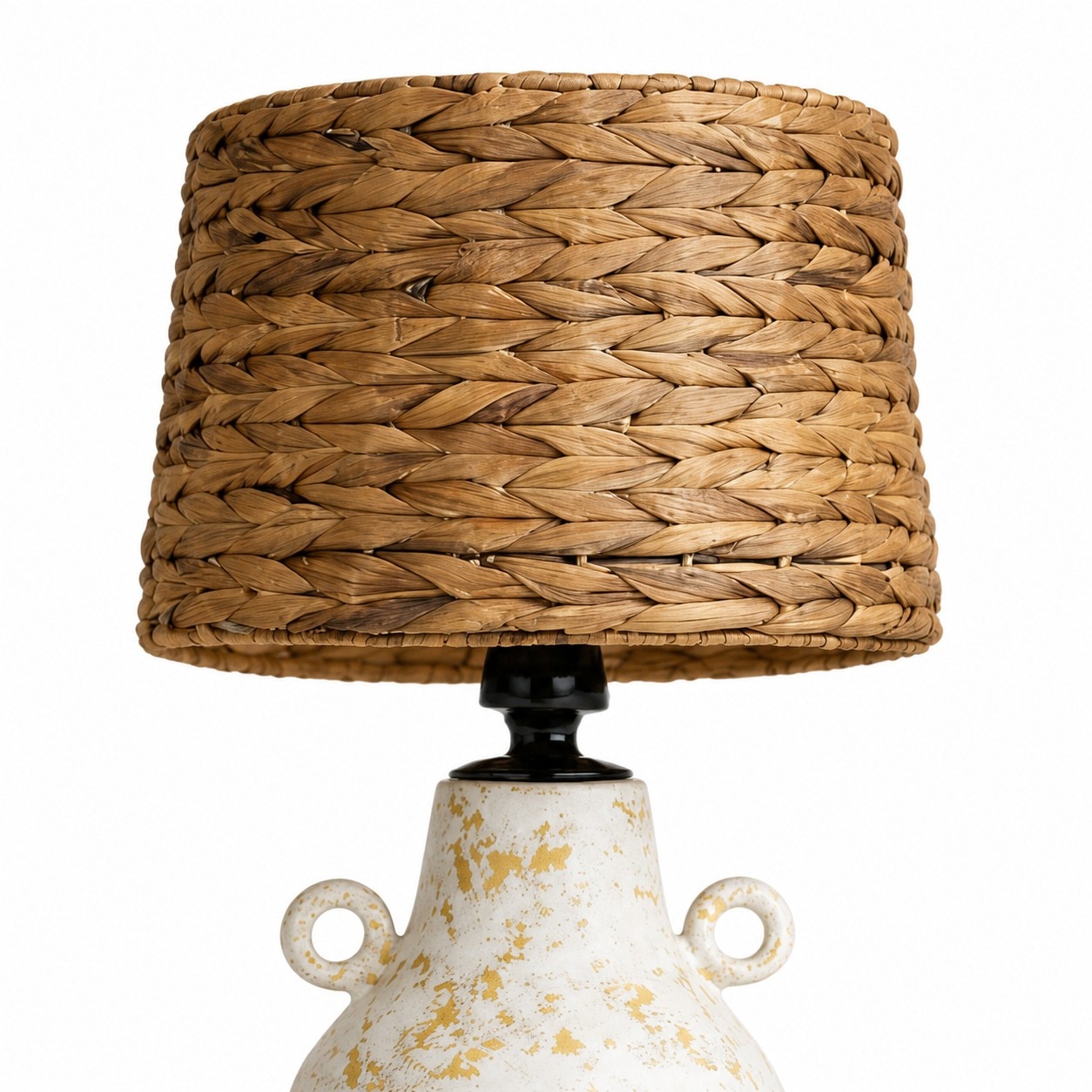 Close view of woven shade and black button switch table lamp top