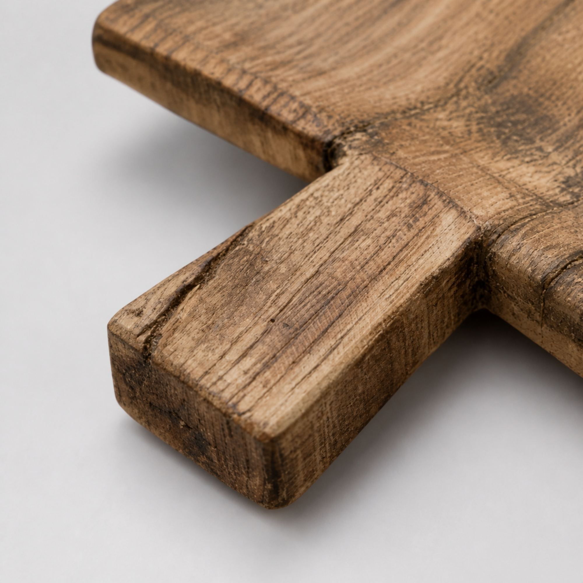 Close-up of thick squared wooden tray handle