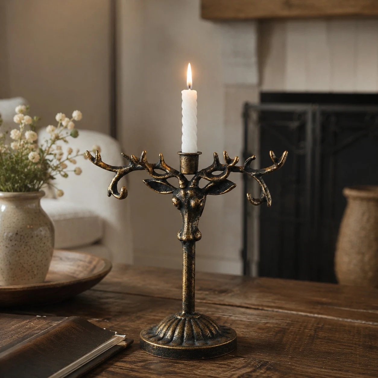 Vintage deer head iron candle holder in a candlelit tabletop scene
