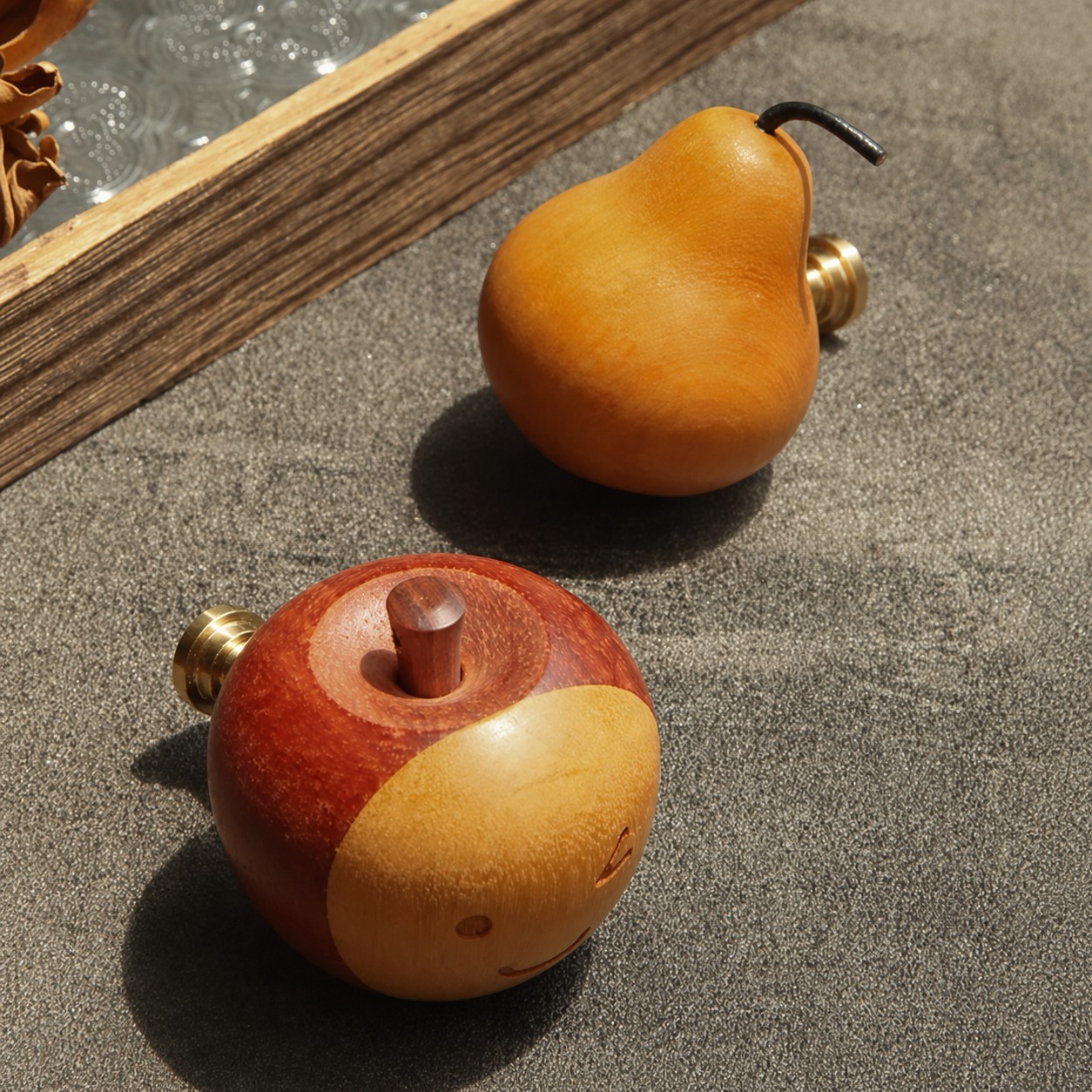 Close-up of polished wooden apple cabinet hardware