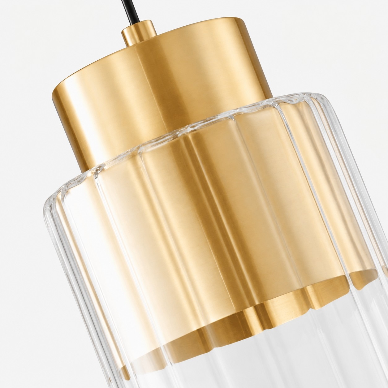 Close-up of brass metal hardware inside ribbed glass pendant light