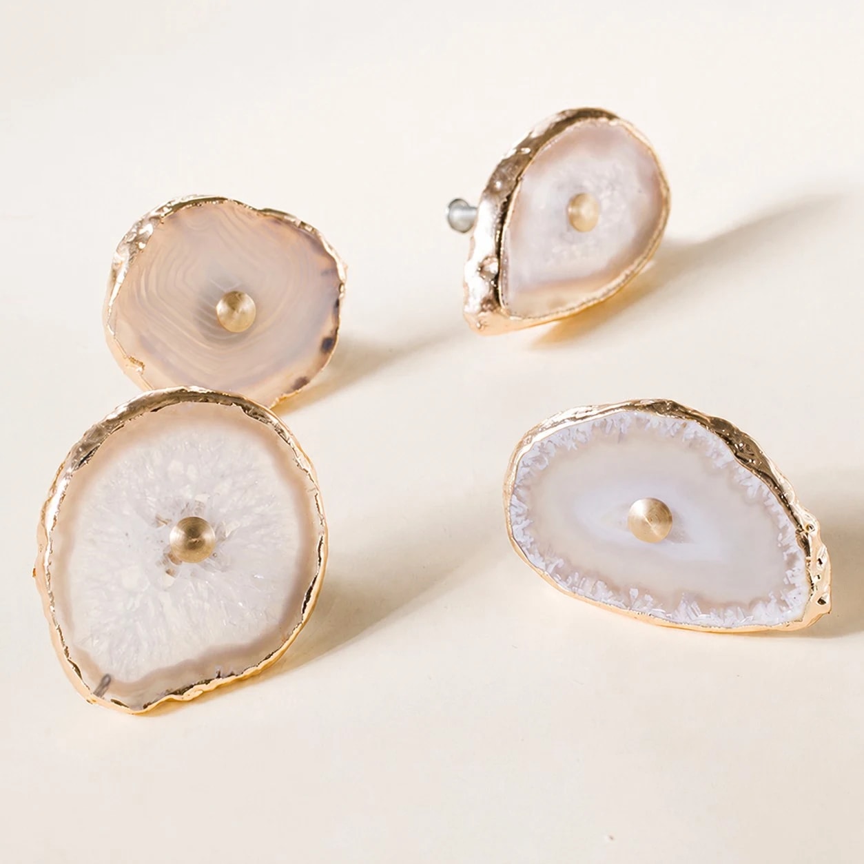 Close view of natural agate cabinet knobs with brass rims