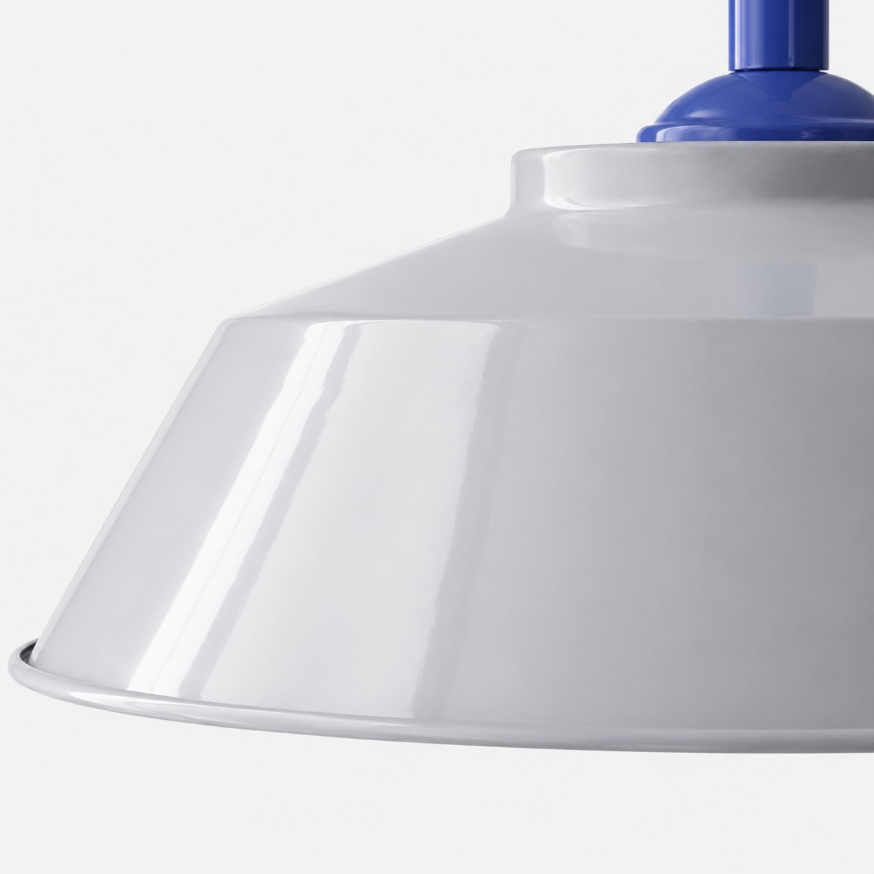 Close view of the painted metal shade and rolled edge