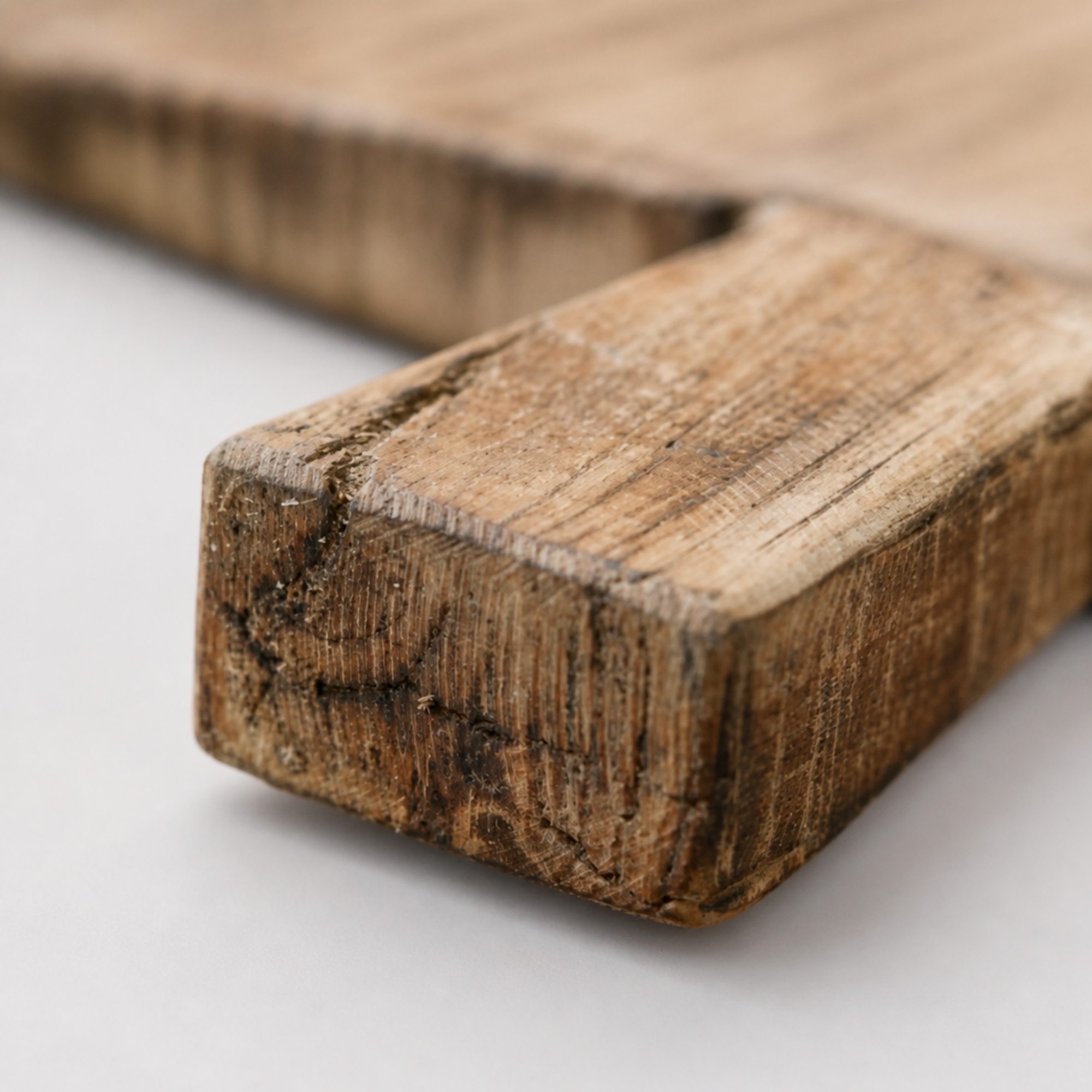 Close-up of weathered end grain on wooden handle
