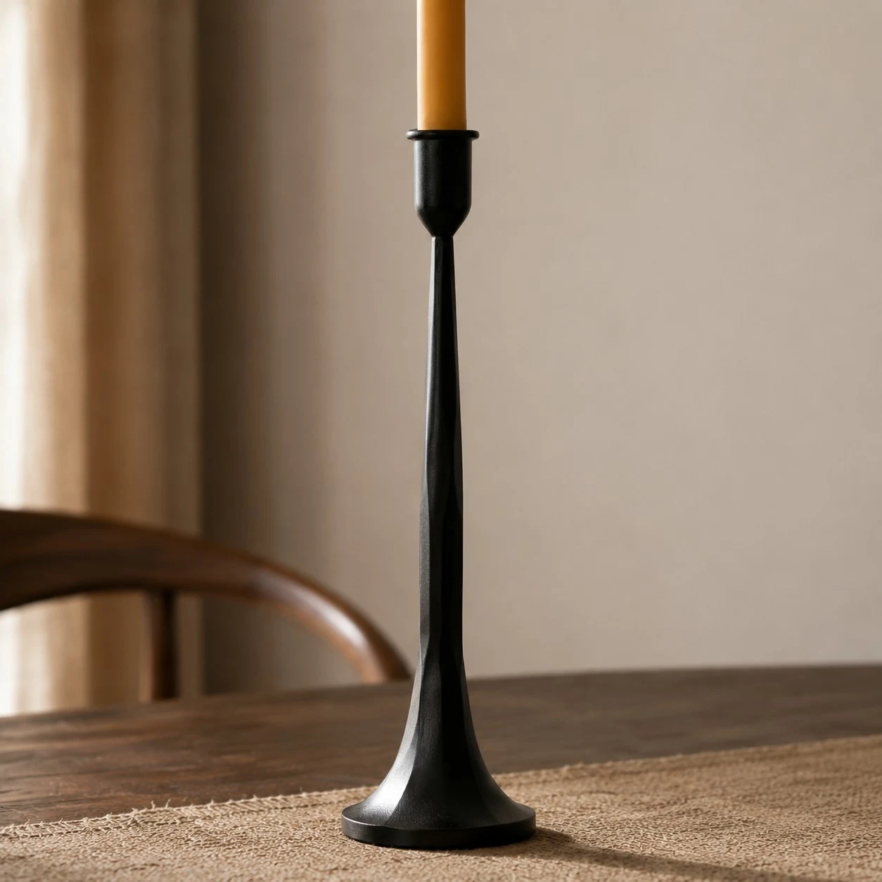 Tall black iron candle holder with flared base