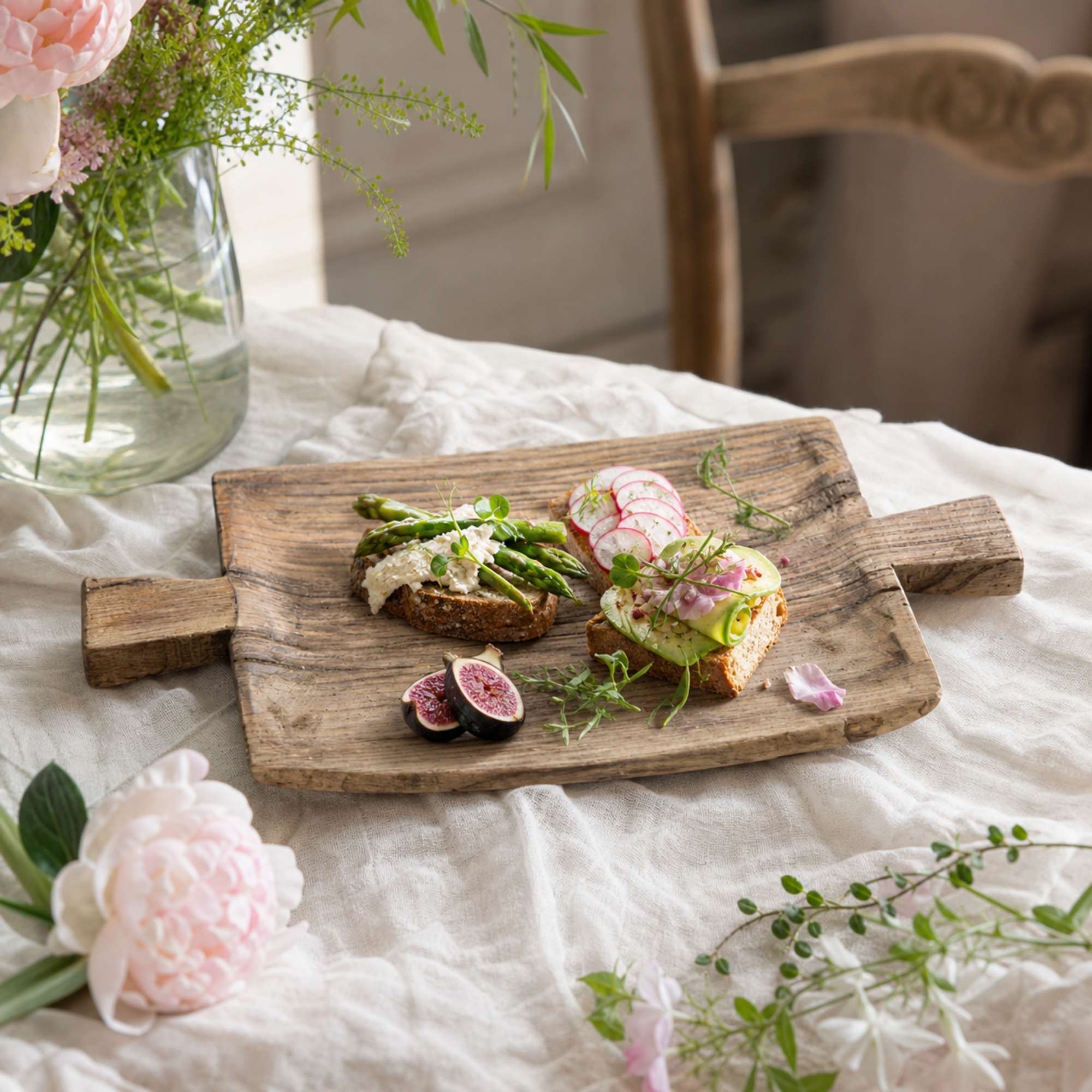 Rustic reclaimed wood tray styled with breakfast on linen
