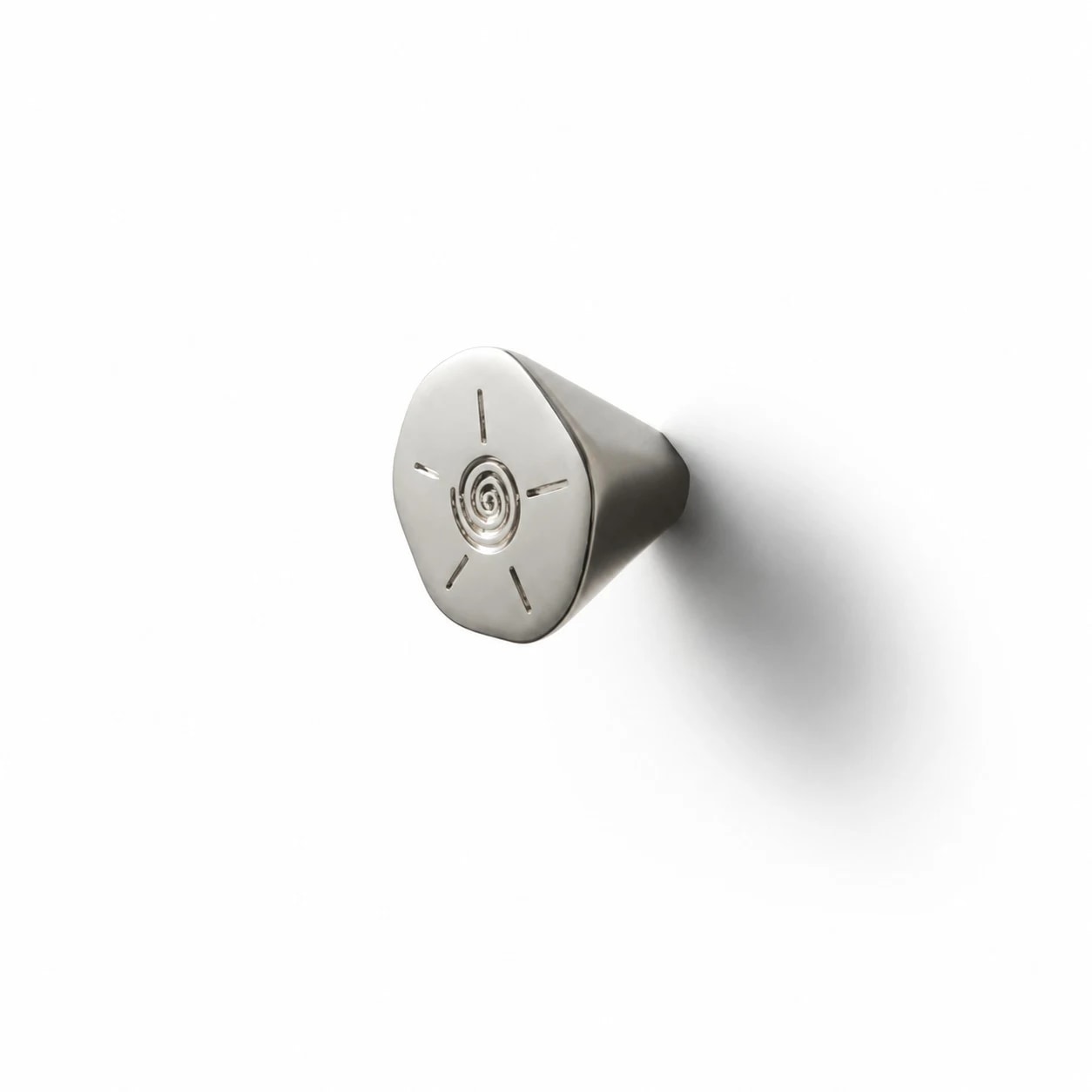Titanium silver solid brass cabinet knob installed on a white surface