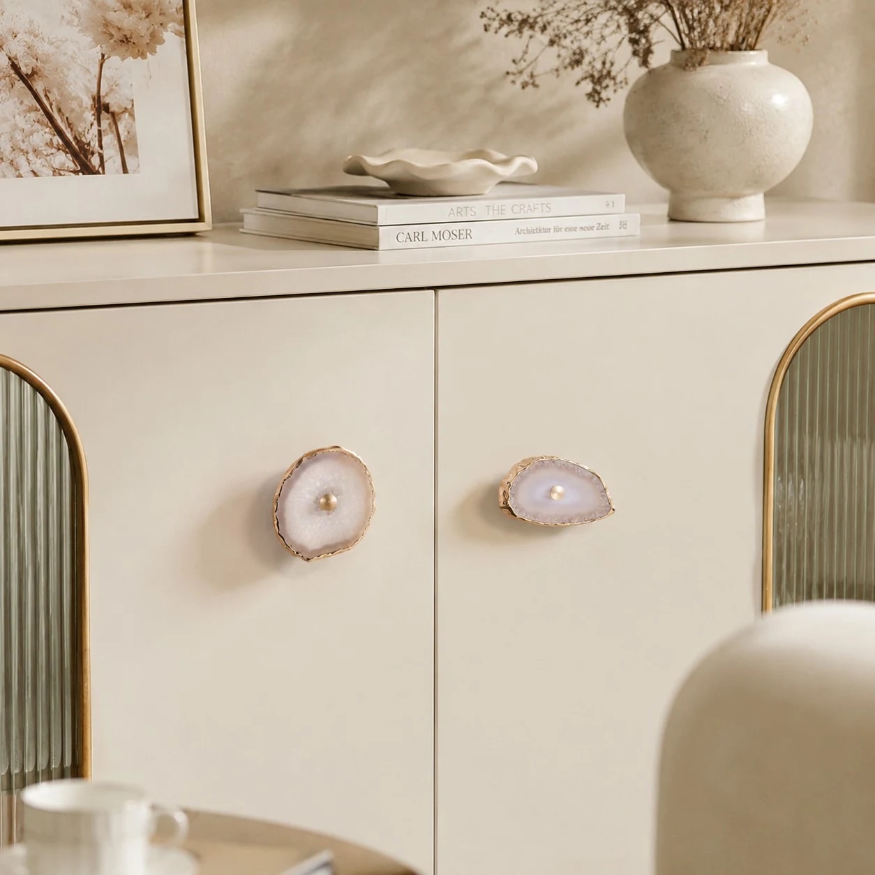Natural agate drawer pulls styled on a cream cabinet