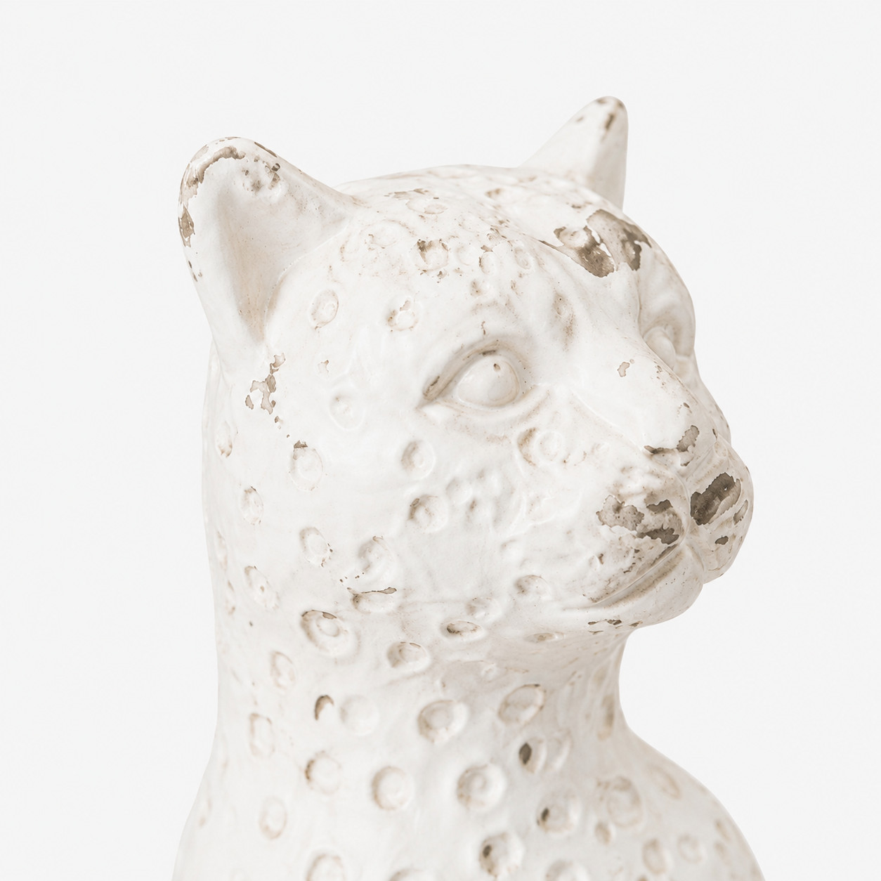 Close-up of the leopard head and aged white finish