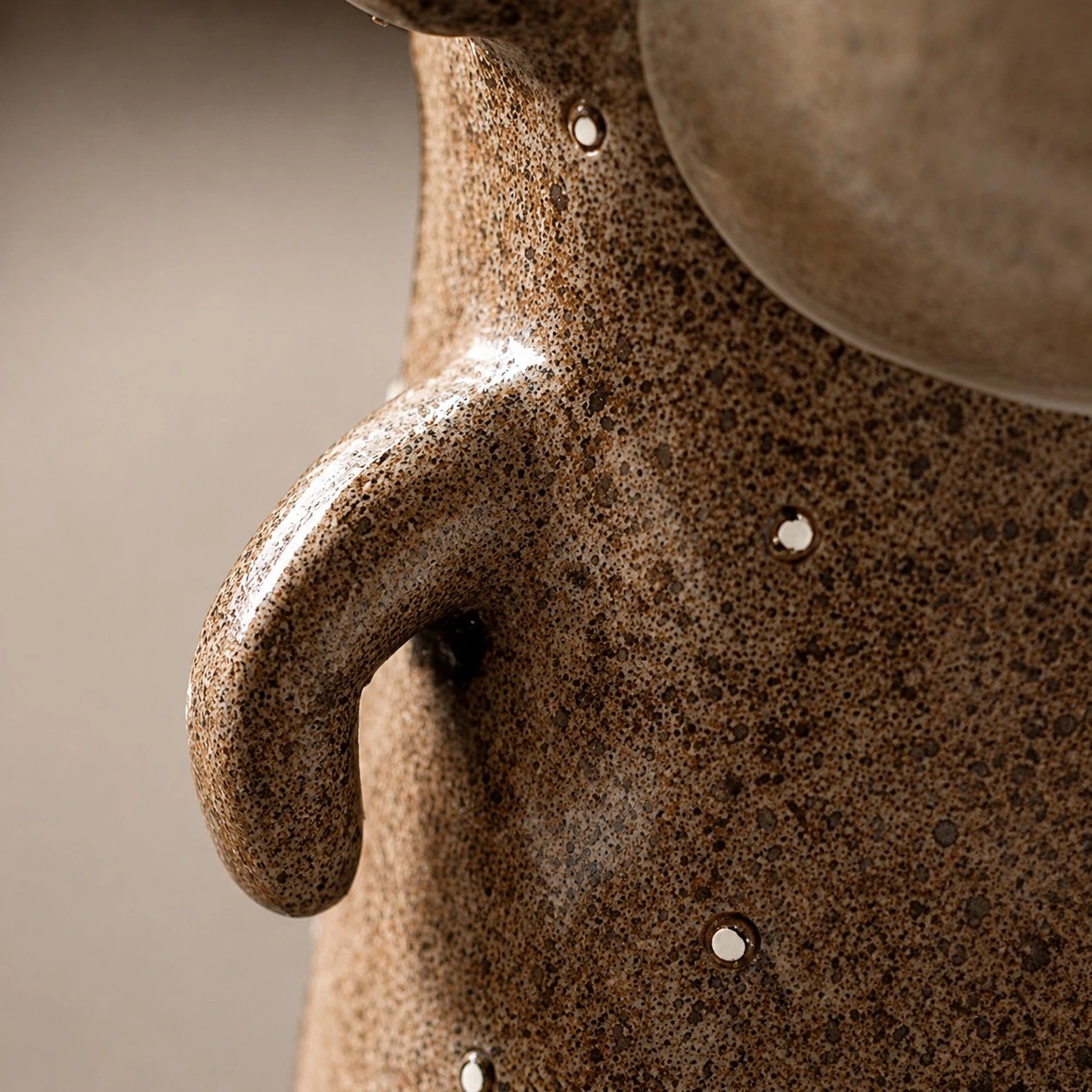 Close view of the monkey bookend's textured resin surface