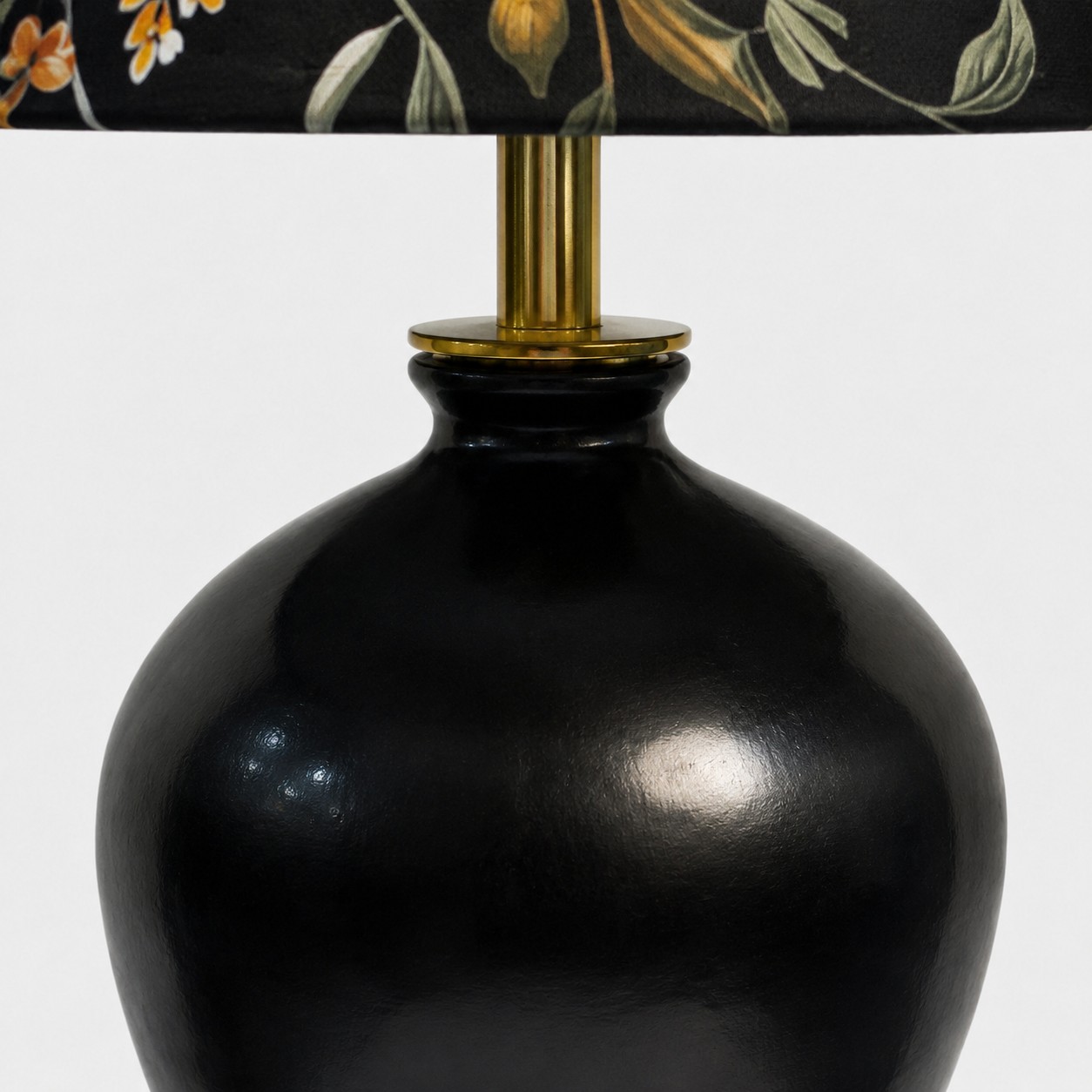 Close view of dark table lamp neck and base