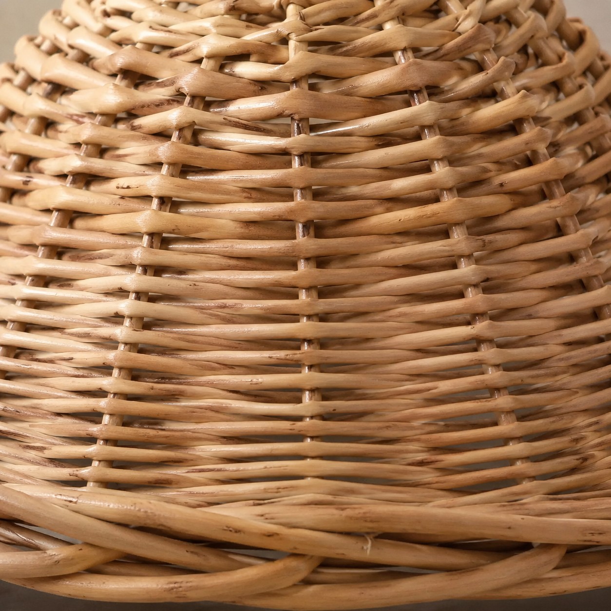 Close-up of the handwoven natural rattan shade