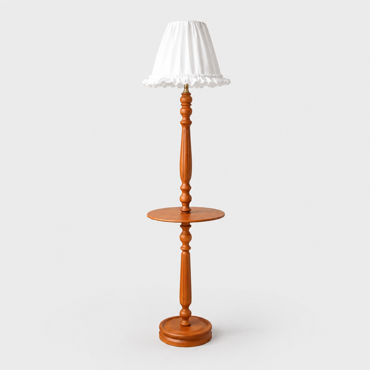 White ruffled shade with side table