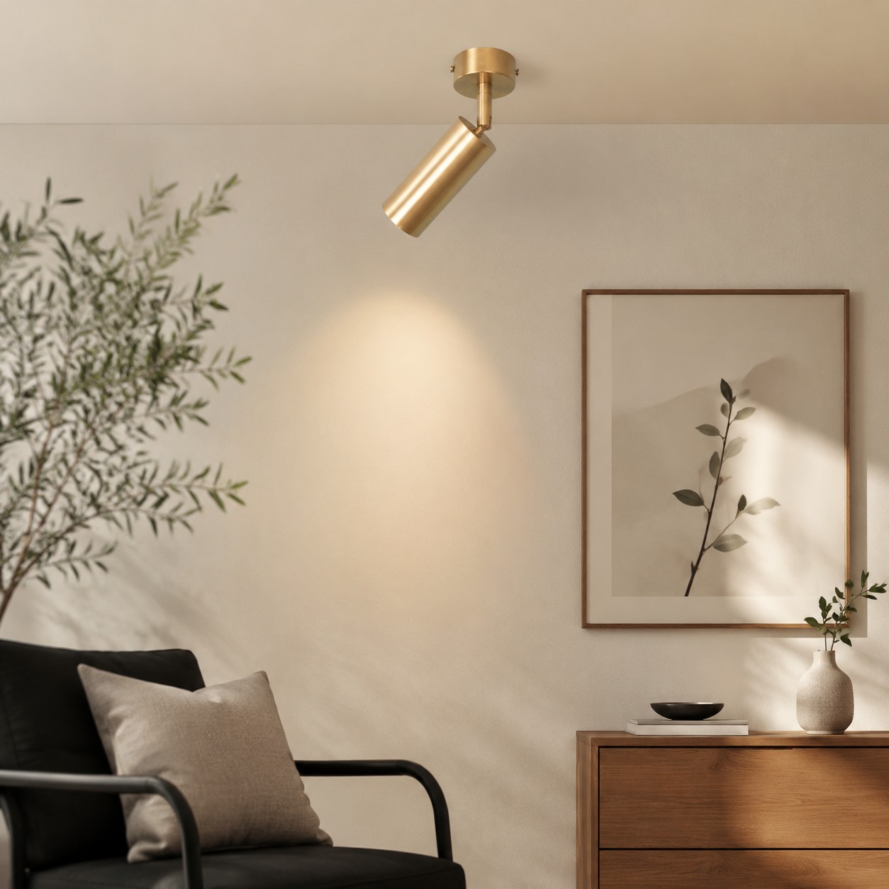 Brass ceiling spotlight installed in a living room setting