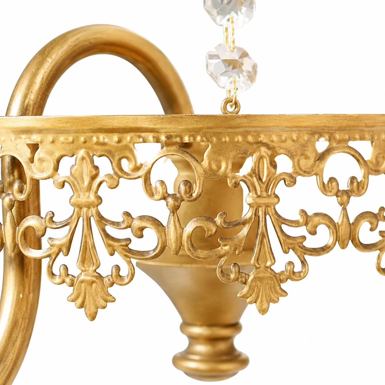 Gold-tone metal scrollwork and crystal detail