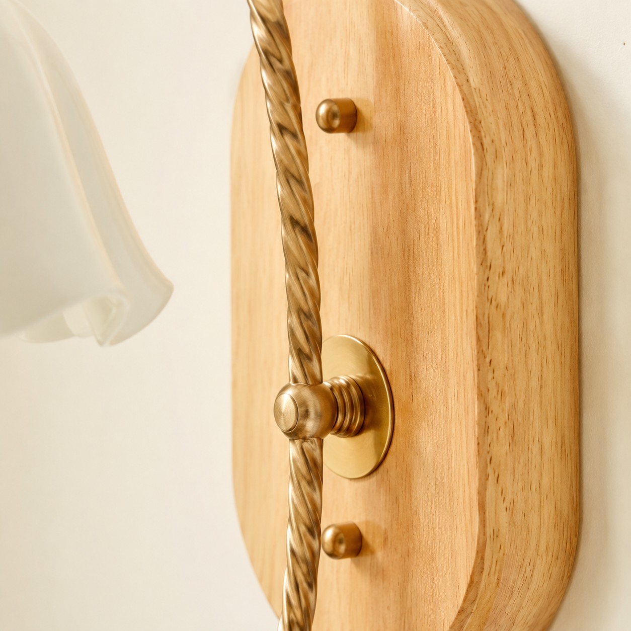 Solid wood wall plate and curved metal arm detail