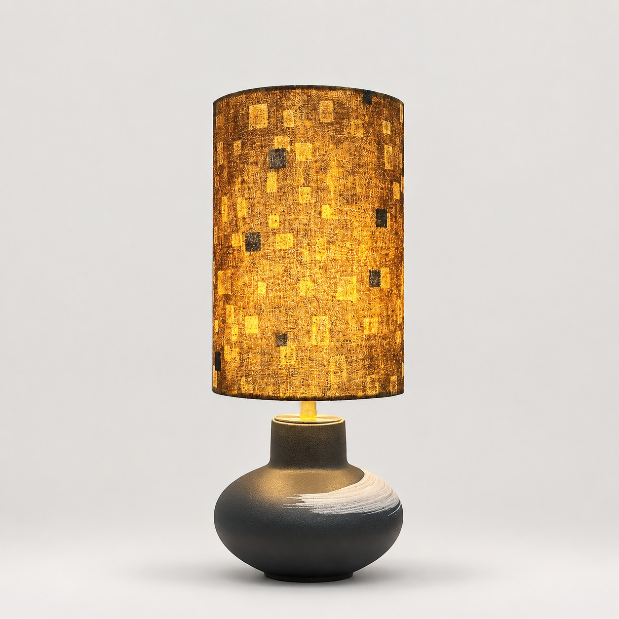 Gold Speckled ceramic table lamp on a light gray background
