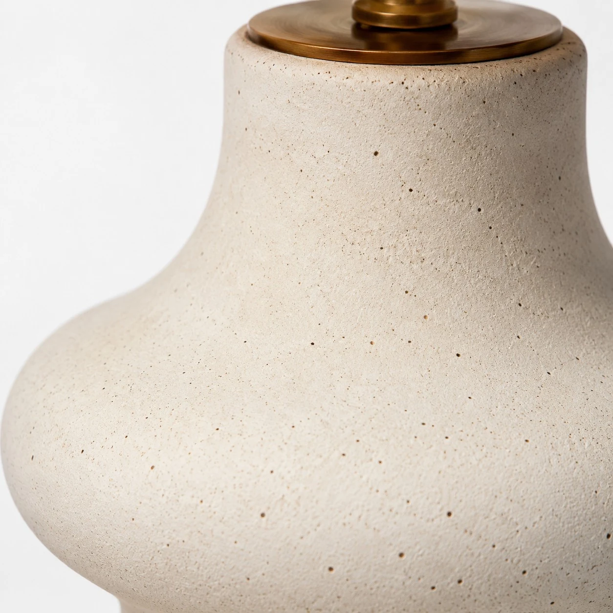 Close detail of handmade ceramic lamp base and neck